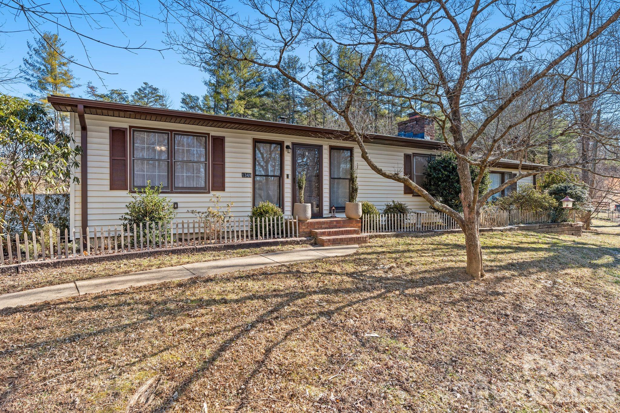 1348 Jenkins Valley Road Alexander, NC 28701 - Photo 2 of 44 a front view of a house with garden