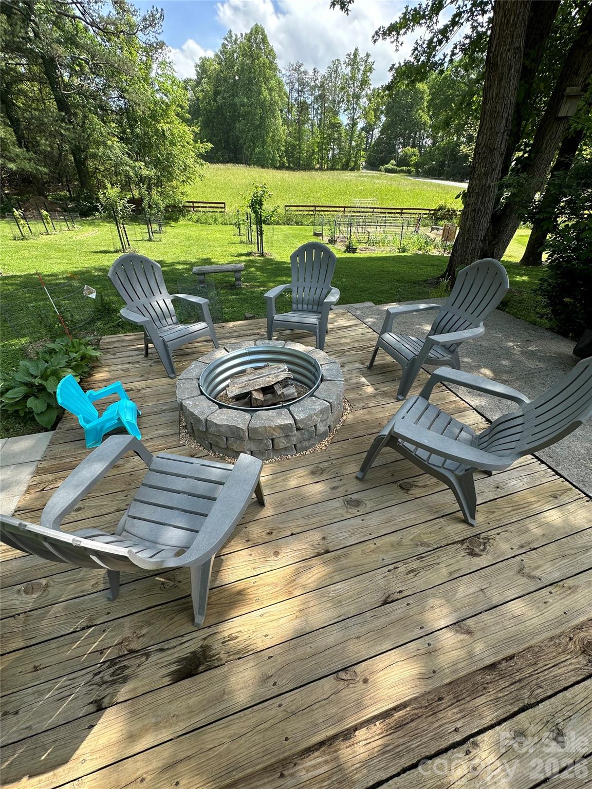 1348 Jenkins Valley Road Alexander, NC 28701 - Photo 38 of 44 a view of a patio with table and chairs with wooden floor and fence