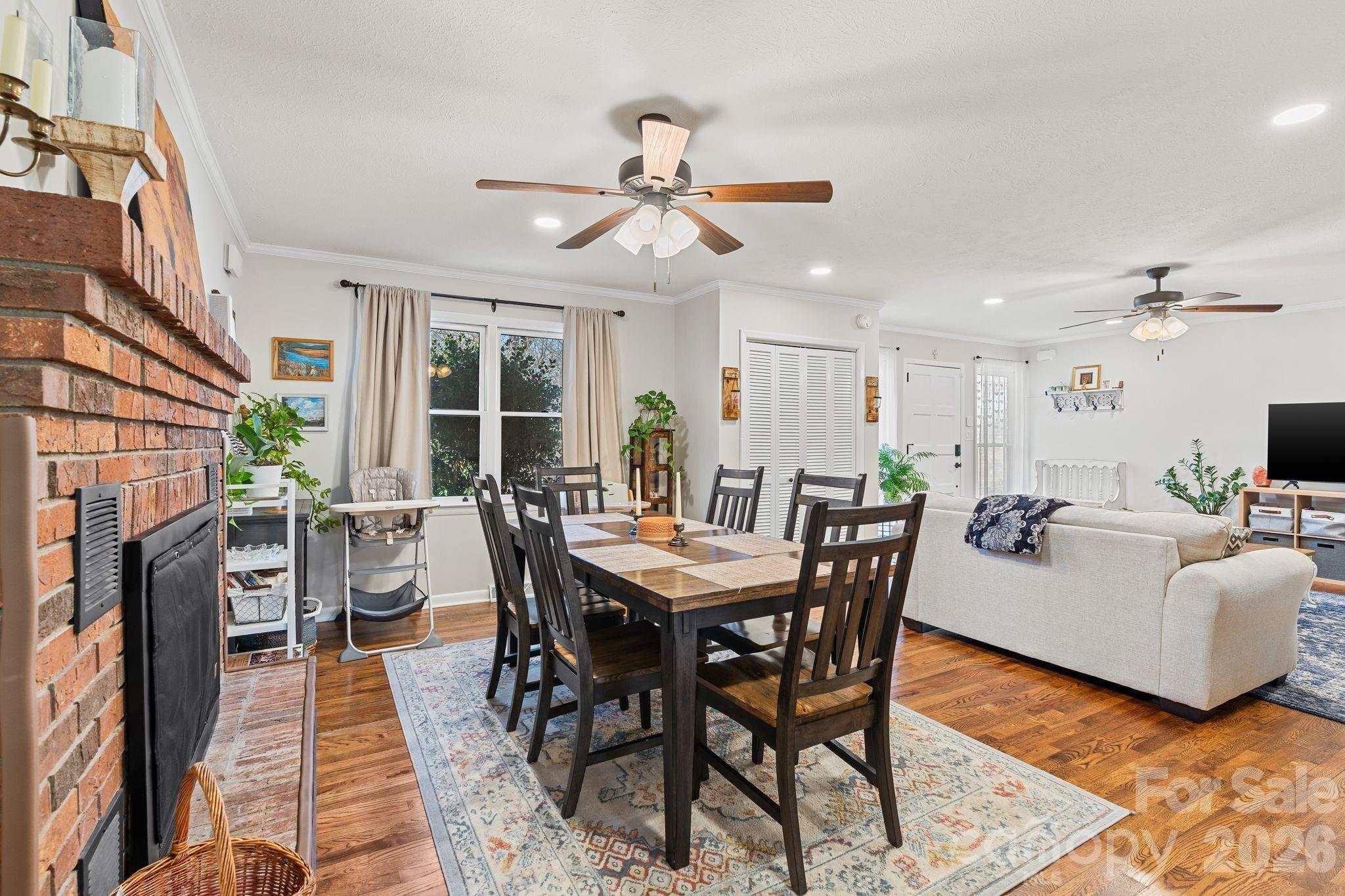 1348 Jenkins Valley Road Alexander, NC 28701 - Photo 5 of 44 a view of a dining room with furniture window and wooden floor