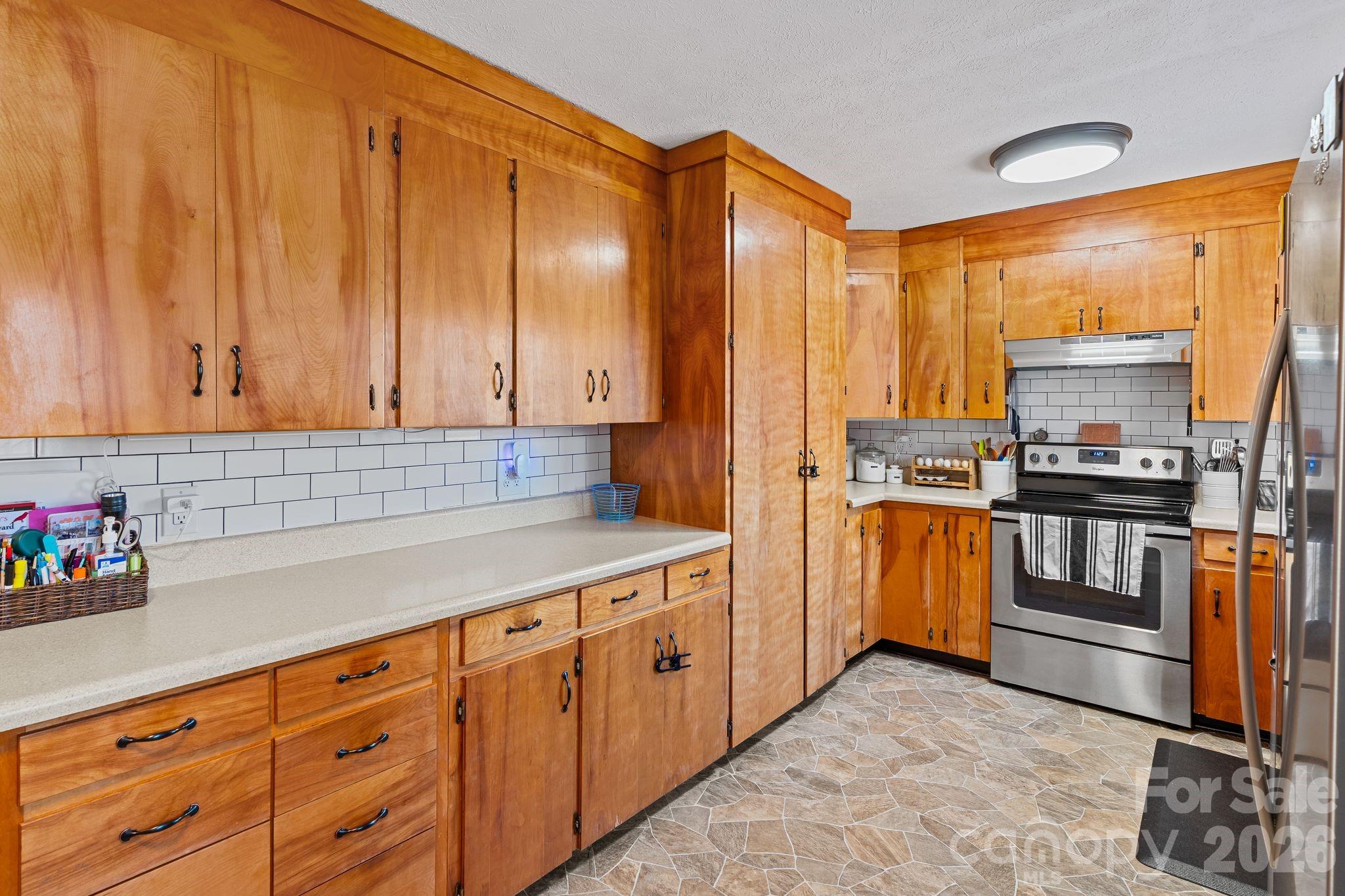 1348 Jenkins Valley Road Alexander, NC 28701 - Photo 7 of 44 a kitchen with cabinets and appliances