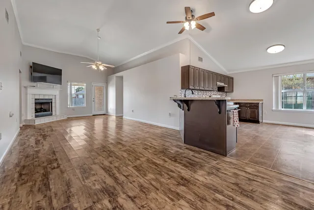 a view of a kitchen with microwave and cabinets