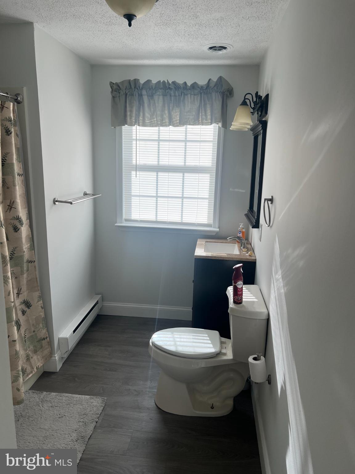 3906 29th Street Chesapeake Beach, MD 20732 - Photo 5 of 6 a bathroom with a toilet and a shower