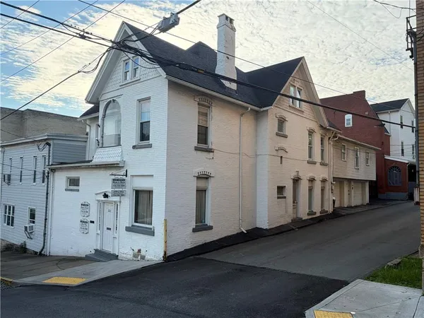 a view of a house with a street