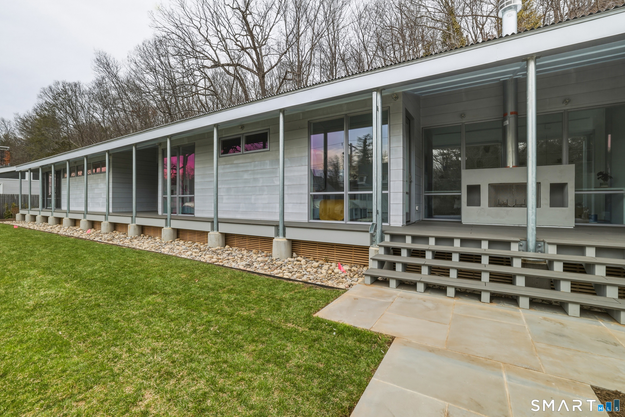 169 Mill Rock Road Hamden, CT 06517 - Photo 2 of 40 a view of a house with backyard and sitting area