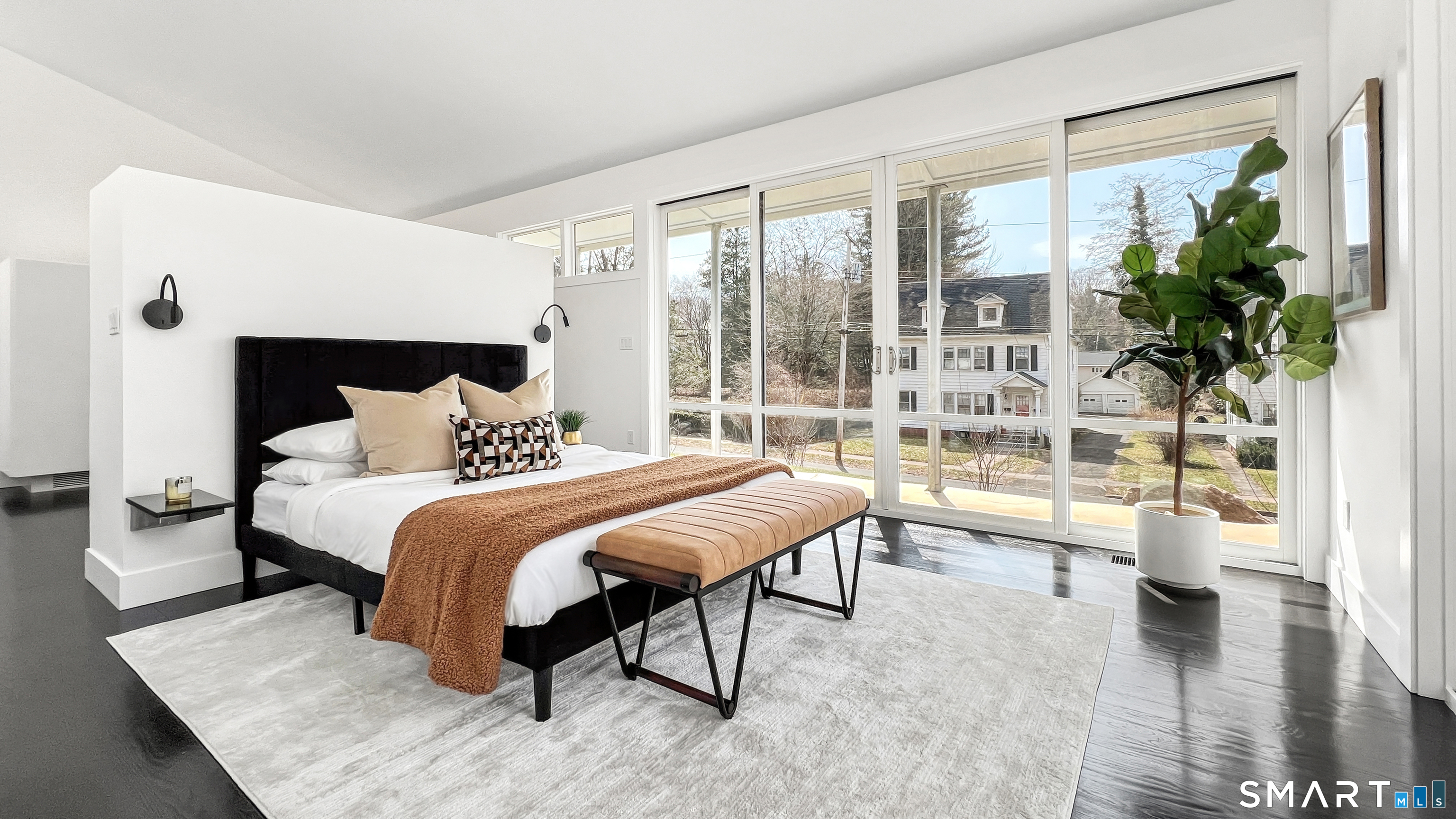 169 Mill Rock Road Hamden, CT 06517 - Photo 21 of 40 a spacious bedroom with a large bed and a large window