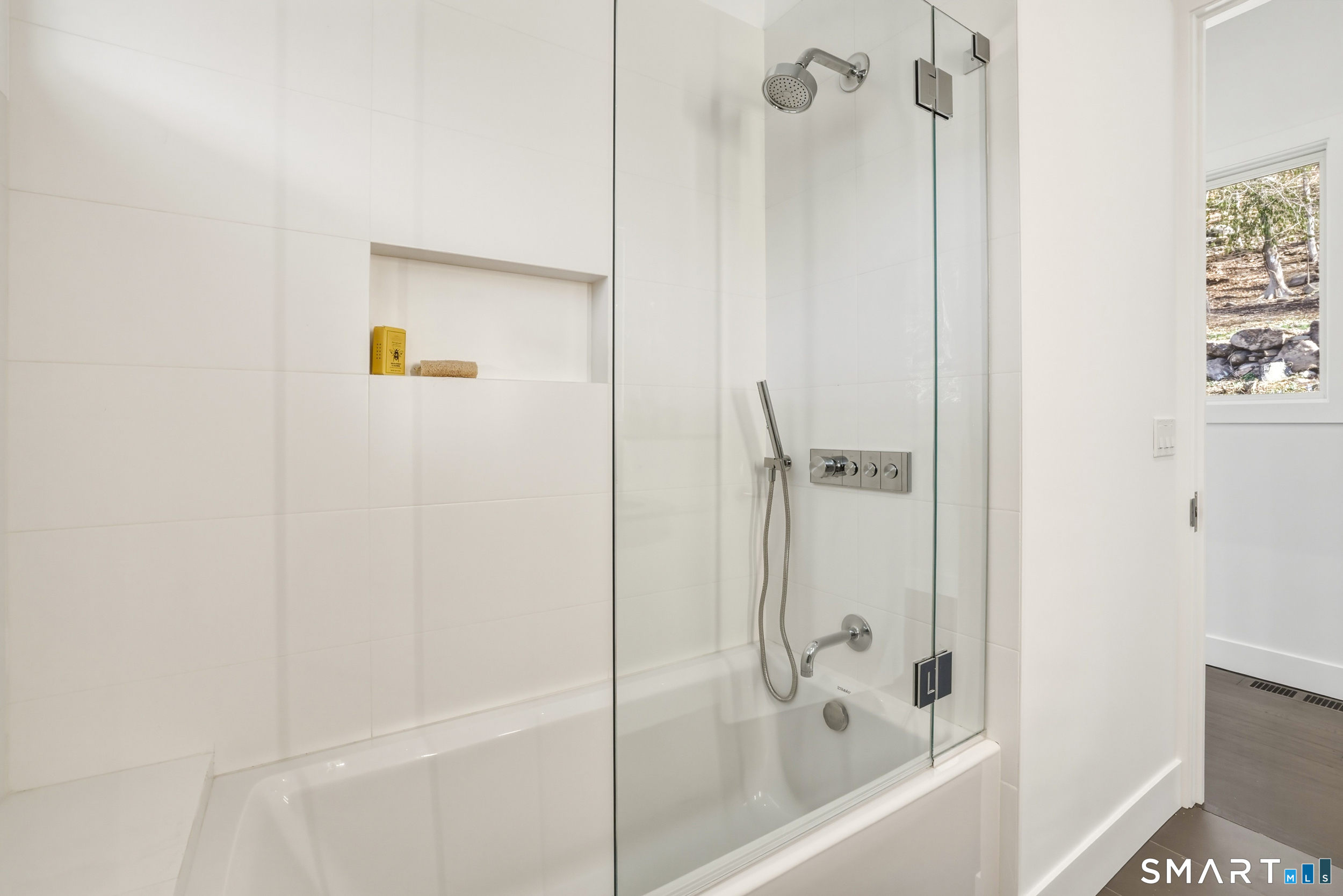 169 Mill Rock Road Hamden, CT 06517 - Photo 30 of 40 a bathroom with a bathtub and a shower