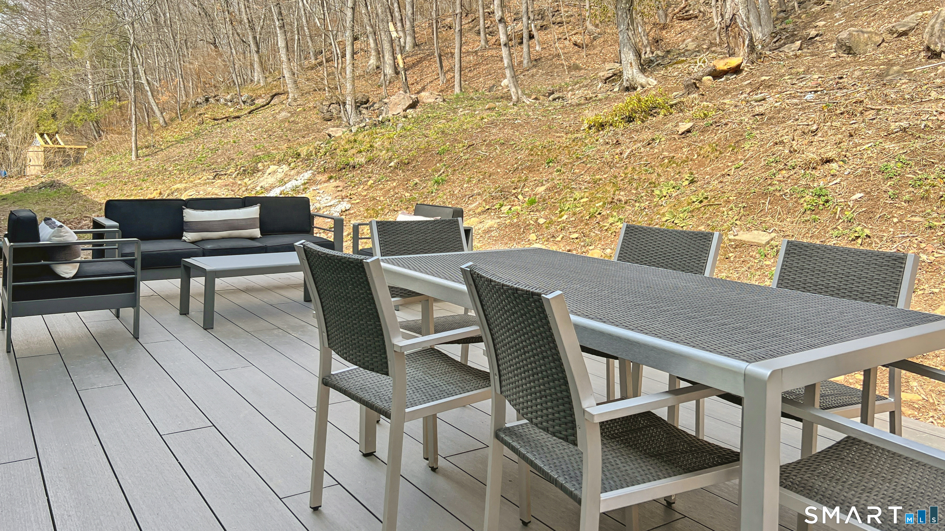 169 Mill Rock Road Hamden, CT 06517 - Photo 5 of 40 a view of a patio with table and chairs with barbeque grill