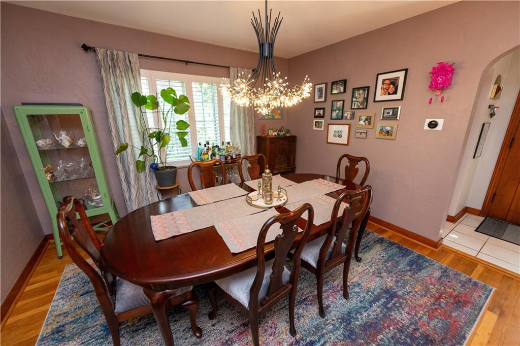 108 Cascade Road Pittsburgh, PA 15221 - Photo 11 of 42 a view of a dining room with furniture window and wooden floor