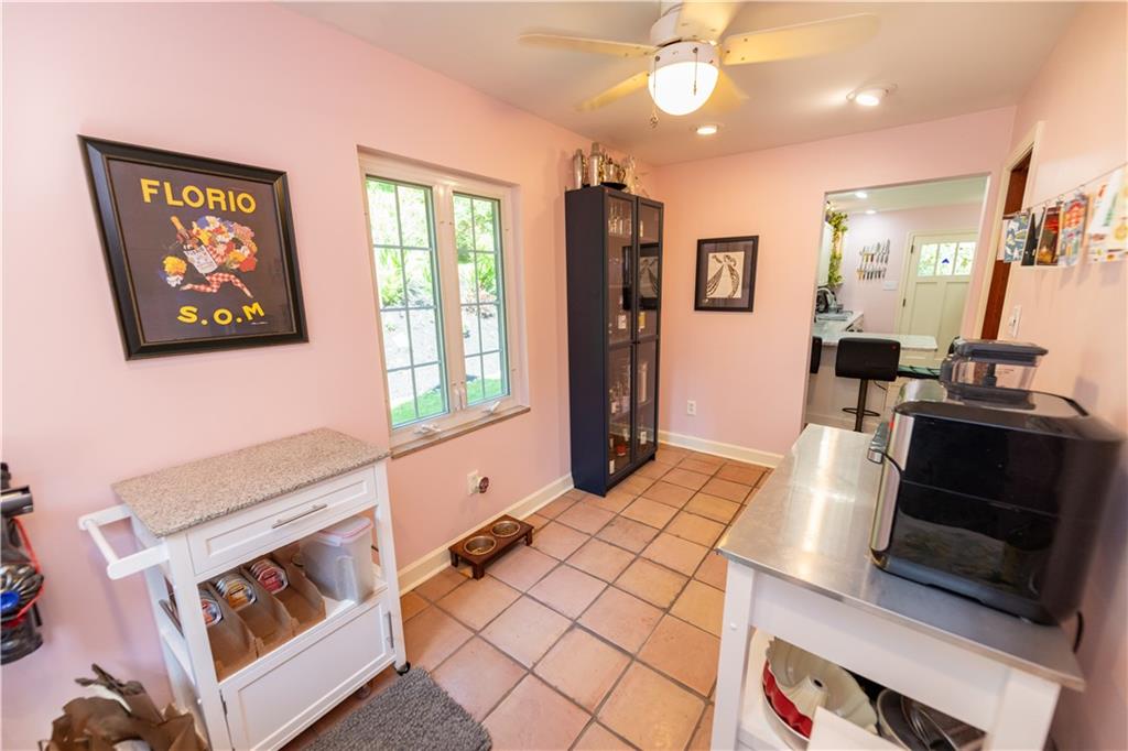 108 Cascade Road Pittsburgh, PA 15221 - Photo 12 of 42 a living room with stainless steel appliances furniture a flat screen tv and a window