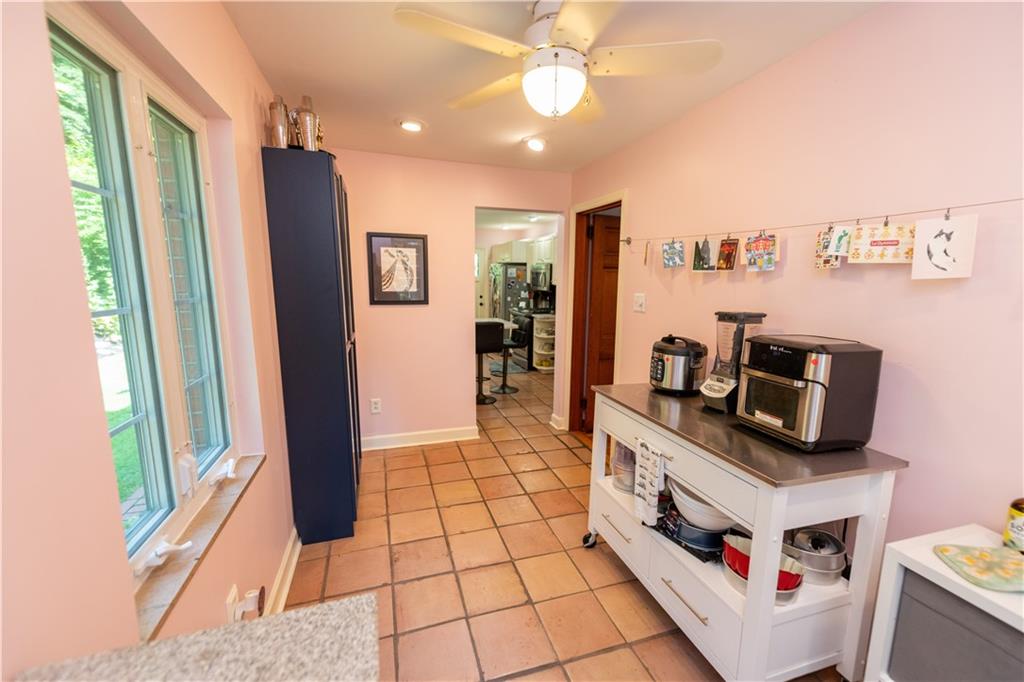 108 Cascade Road Pittsburgh, PA 15221 - Photo 13 of 42 a kitchen with stainless steel appliances a stove a refrigerator and cabinets