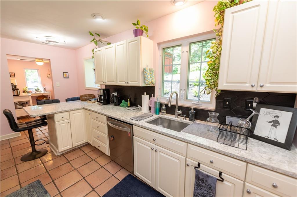 108 Cascade Road Pittsburgh, PA 15221 - Photo 17 of 42 a kitchen with a sink cabinets and window