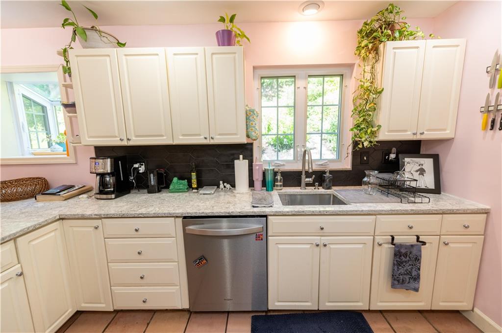 108 Cascade Road Pittsburgh, PA 15221 - Photo 19 of 42 a kitchen with granite countertop white cabinets and white appliances
