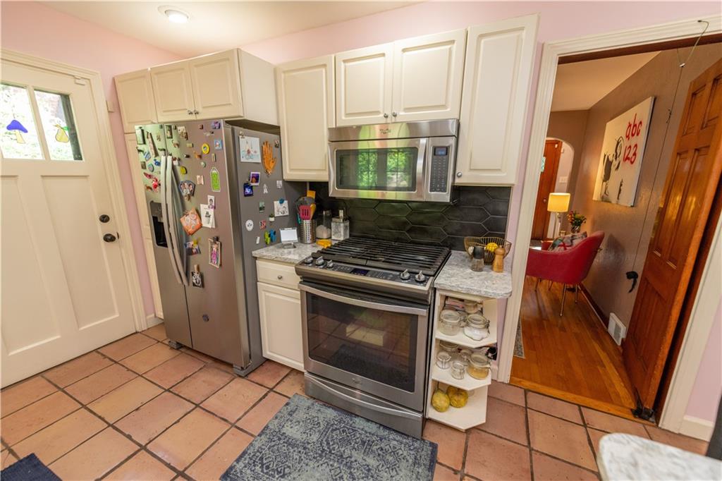 108 Cascade Road Pittsburgh, PA 15221 - Photo 20 of 42 a kitchen with stainless steel appliances granite countertop a refrigerator stove and sink