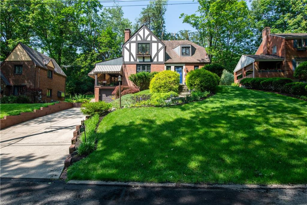 108 Cascade Road Pittsburgh, PA 15221 - Photo 2 of 42 a front view of a house with a yard