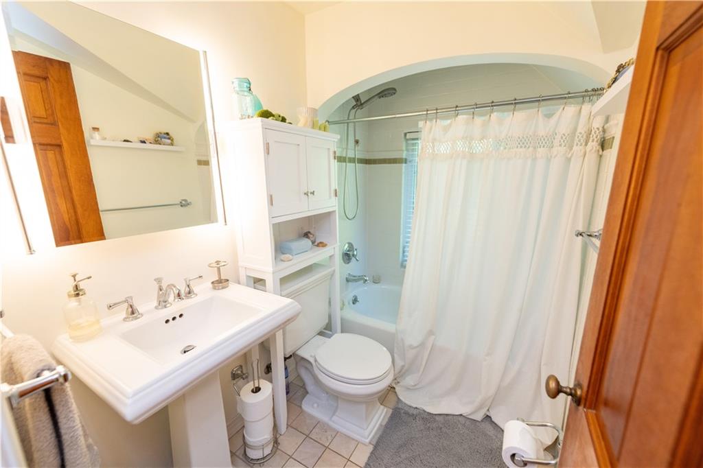108 Cascade Road Pittsburgh, PA 15221 - Photo 27 of 42 a bathroom with a sink a toilet and a mirror