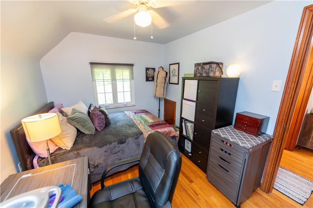 108 Cascade Road Pittsburgh, PA 15221 - Photo 29 of 42 a living room with furniture and a flat screen tv