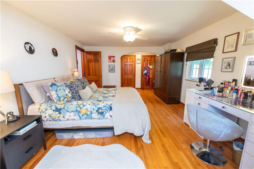 108 Cascade Road Pittsburgh, PA 15221 - Photo 32 of 42 a bed room with a bed mirror and couch