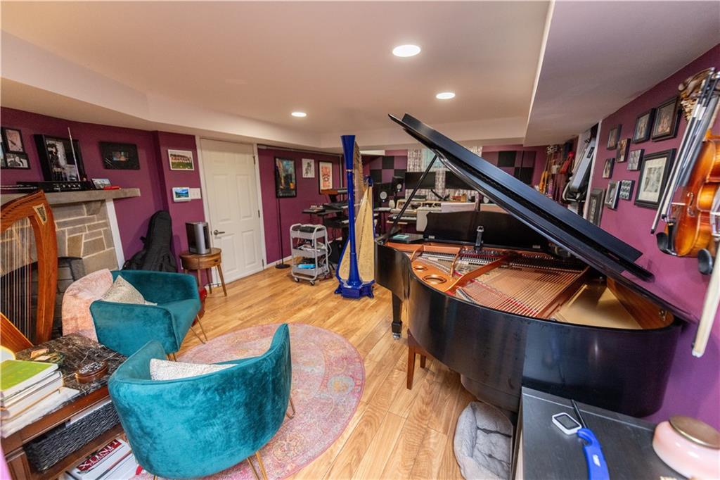 108 Cascade Road Pittsburgh, PA 15221 - Photo 35 of 42 a living room with furniture and a book shelf