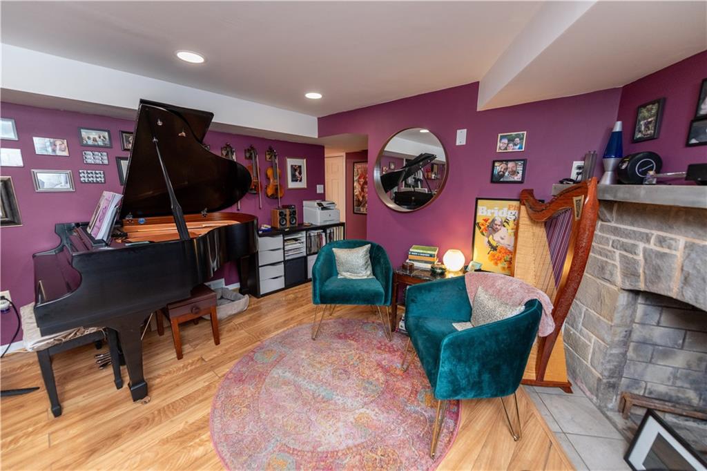 108 Cascade Road Pittsburgh, PA 15221 - Photo 36 of 42 a living room with furniture and a flat screen tv