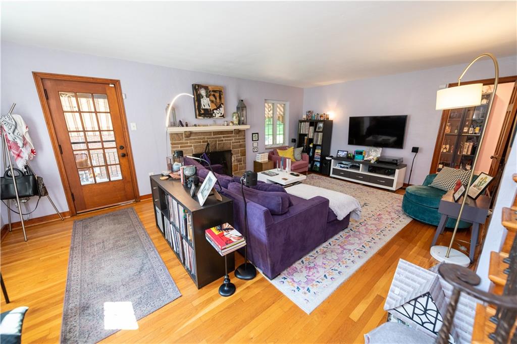 108 Cascade Road Pittsburgh, PA 15221 - Photo 4 of 42 a living room with furniture fireplace and a flat screen tv