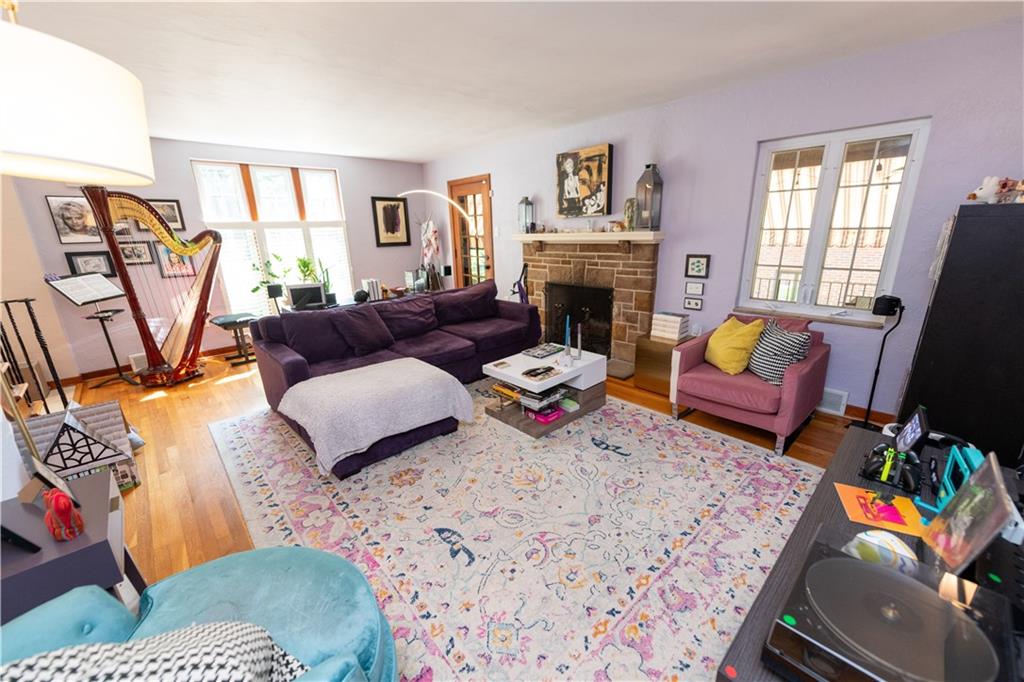 108 Cascade Road Pittsburgh, PA 15221 - Photo 5 of 42 a living room with furniture fireplace and a flat screen tv
