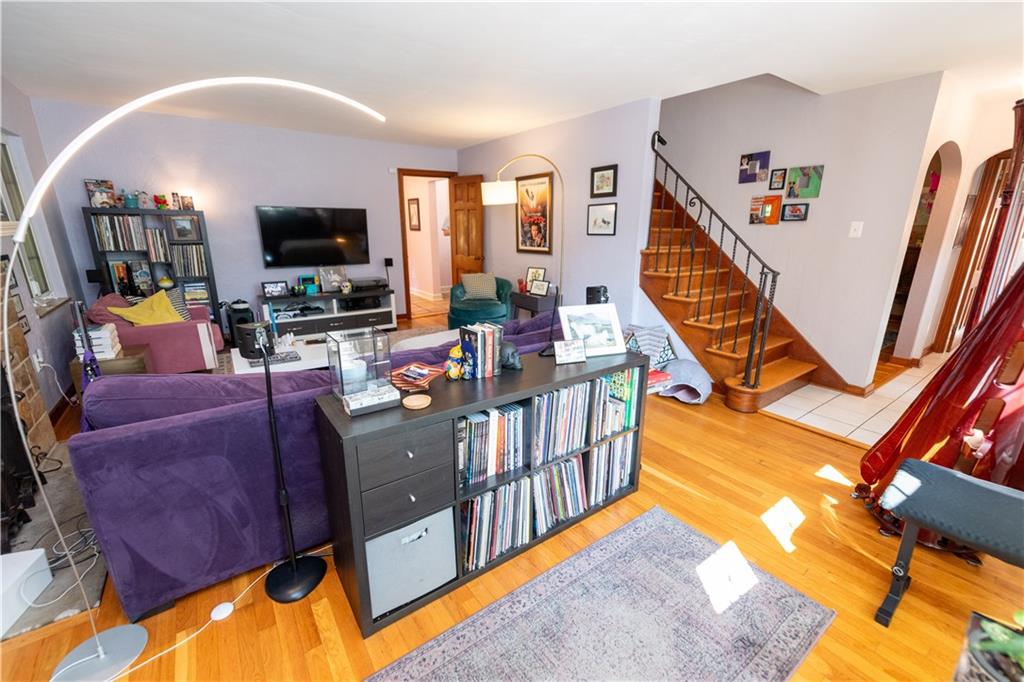 108 Cascade Road Pittsburgh, PA 15221 - Photo 6 of 42 a living room with furniture fireplace and flat screen tv