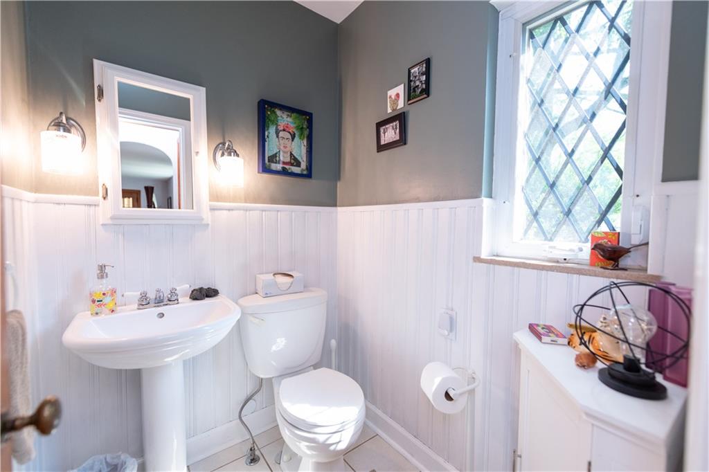 108 Cascade Road Pittsburgh, PA 15221 - Photo 10 of 42 a bathroom with a sink toilet and shower curtain