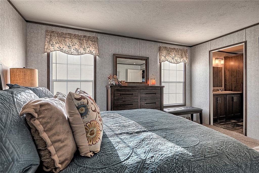 104 Clifton Street Derry, PA 15627 - Photo 13 of 35 a bedroom with a large bed and a window