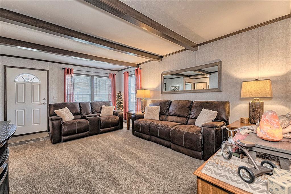 104 Clifton Street Derry, PA 15627 - Photo 18 of 35 a living room with furniture and a lamp