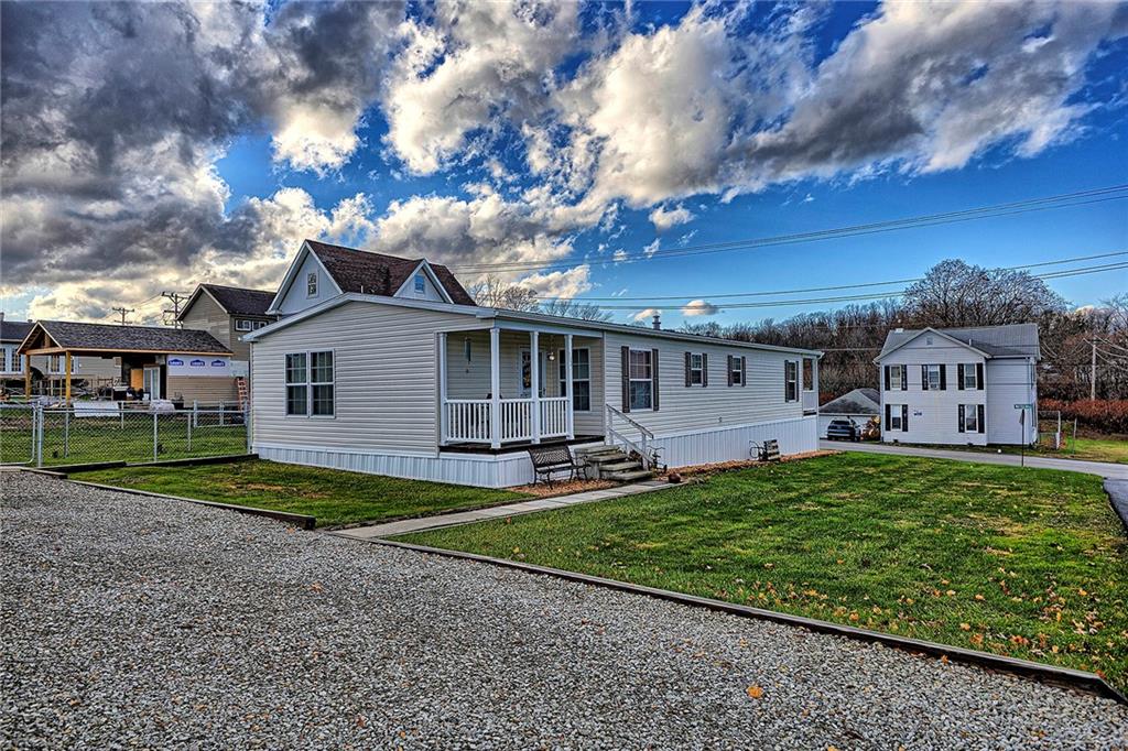 104 Clifton Street Derry, PA 15627 - Photo 30 of 35 a view of a house with a yard and a large tree