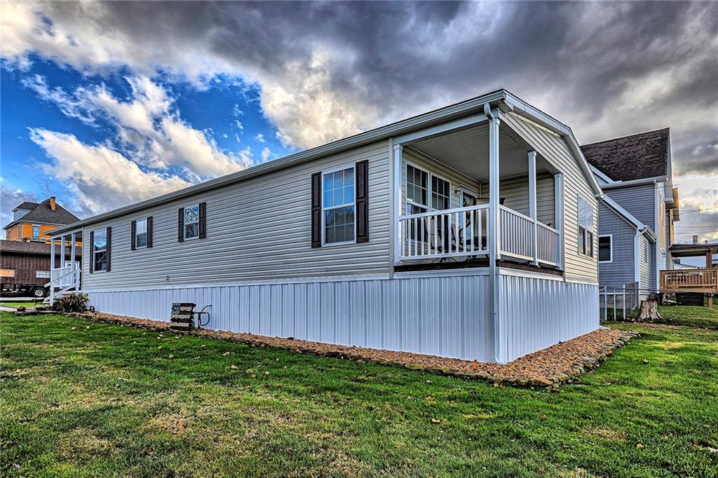104 Clifton Street Derry, PA 15627 - Photo 32 of 35 a front view of a house with garden
