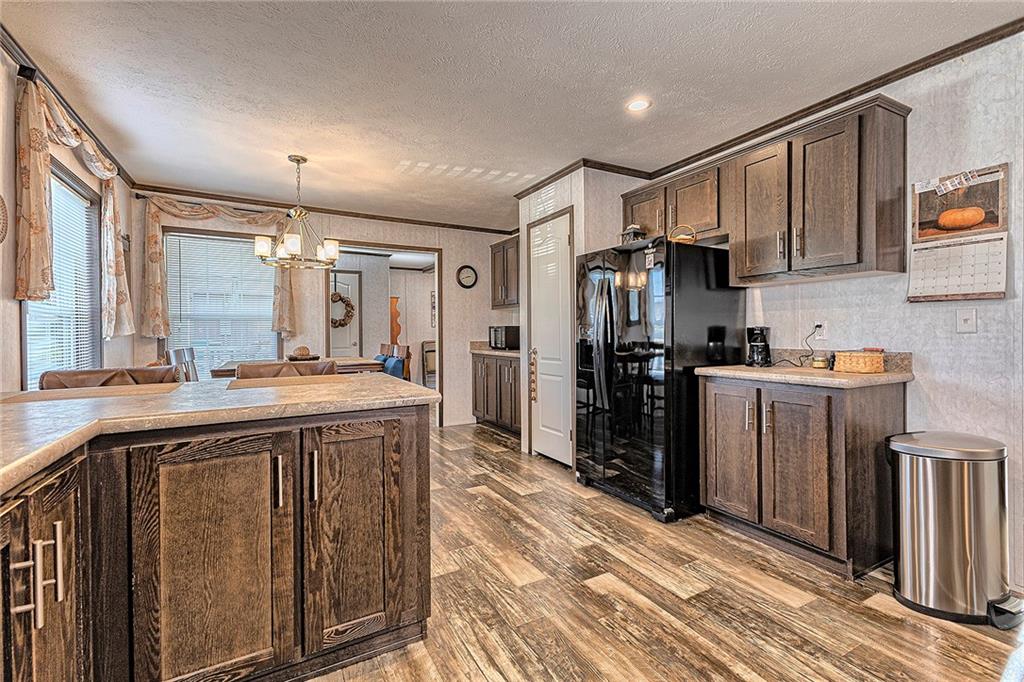 104 Clifton Street Derry, PA 15627 - Photo 9 of 35 a kitchen with stainless steel appliances granite countertop a refrigerator a sink and a stove