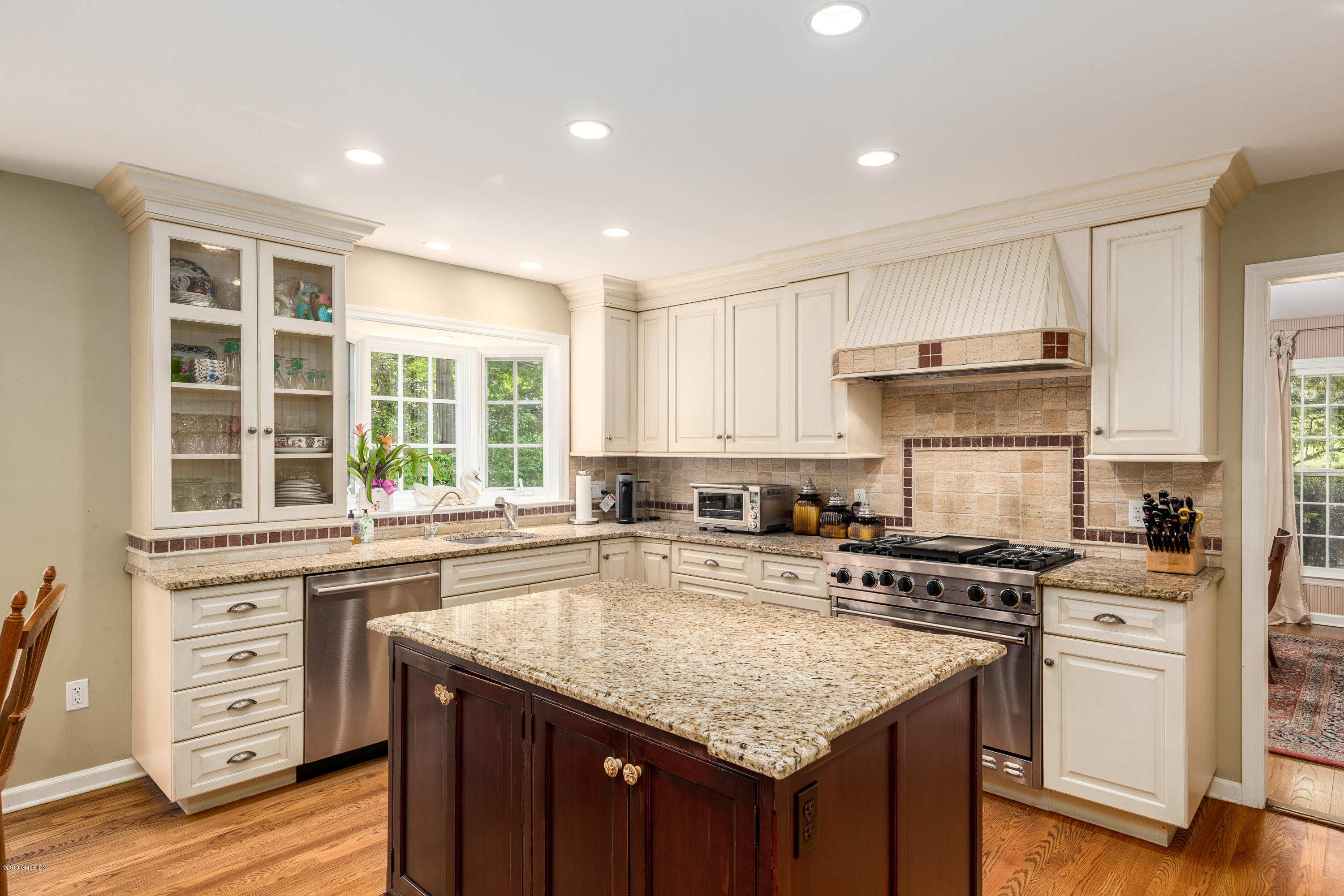 33 Wesskum Wood Road Riverside, CT 06878 - Photo 10 of 27 a kitchen with stainless steel appliances granite countertop a stove and a sink