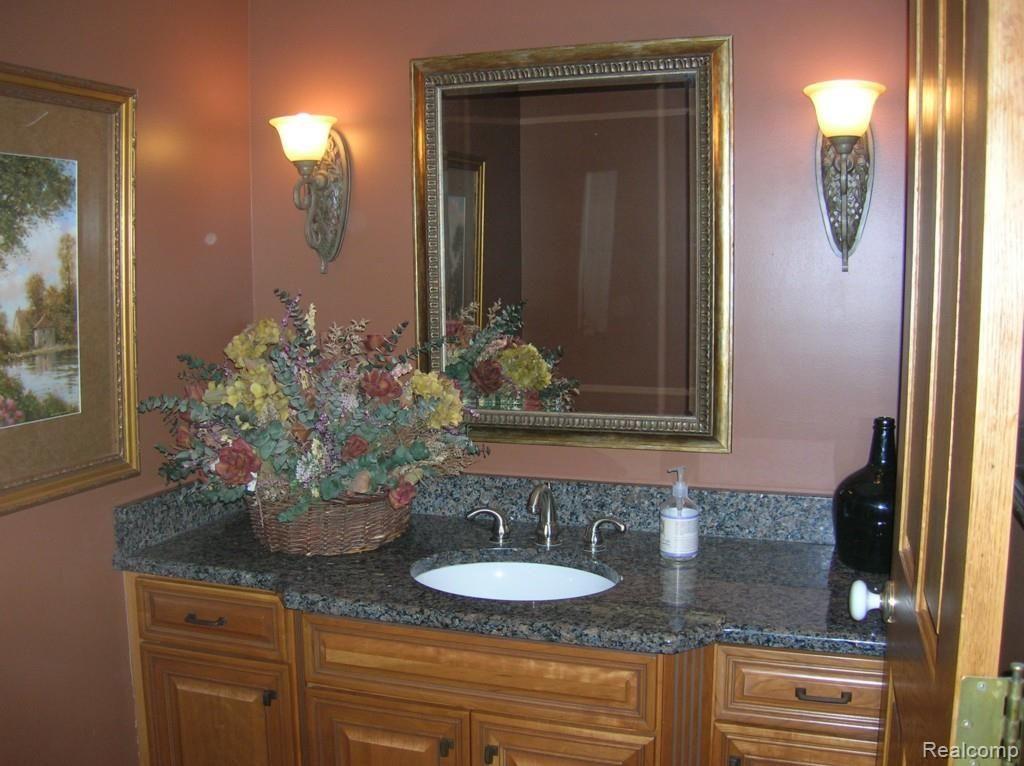 1151 South Adams Road Rochester, MI 48309 - Photo 44 of 44 Remodeled Half Bath with Granite & Hardwood