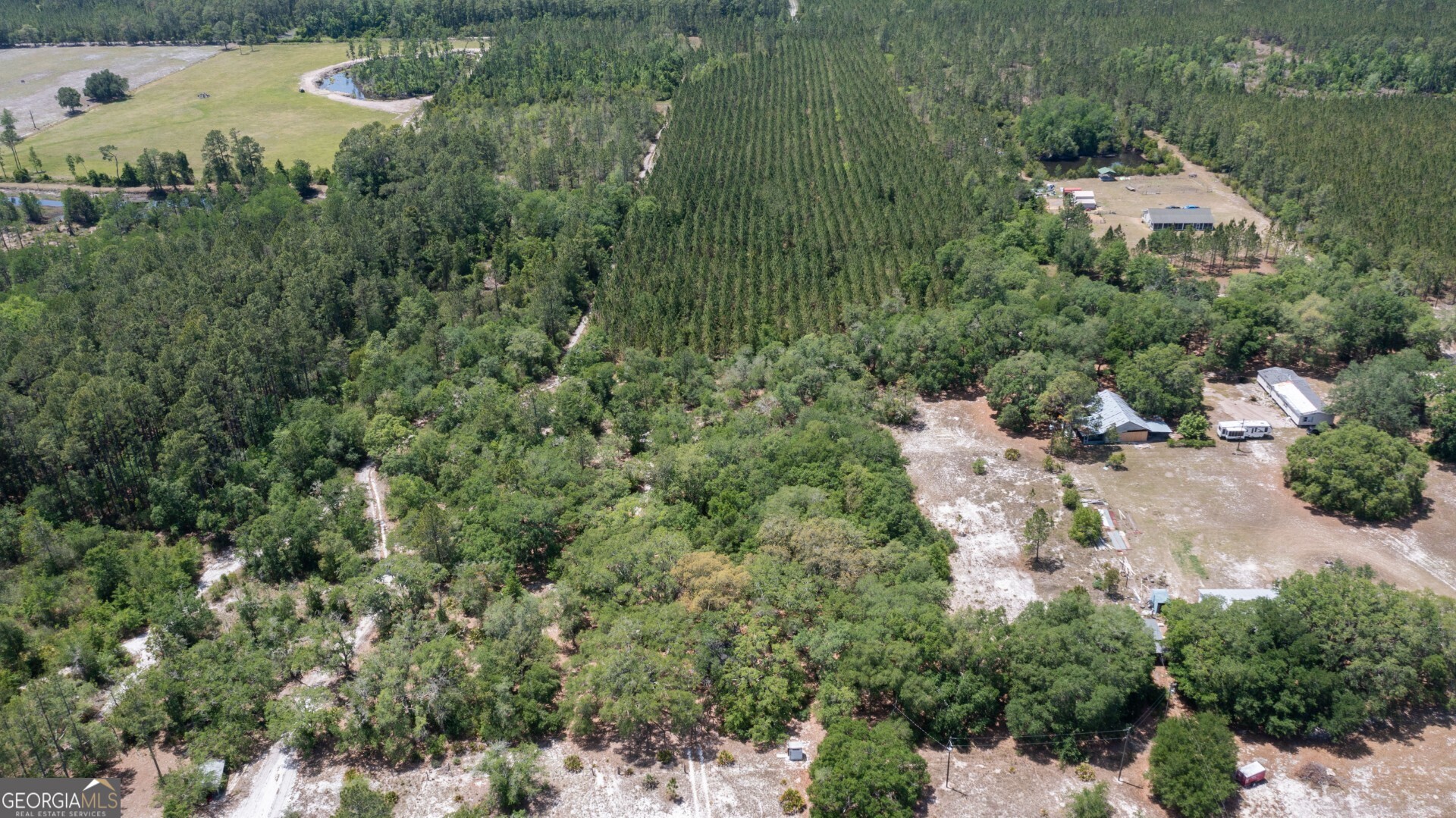 779 Ralph Davis Road, Unit 1 LAND LOT Folkston, GA 31537 - Photo 25 of 28 an aerial view of a house with a lake view