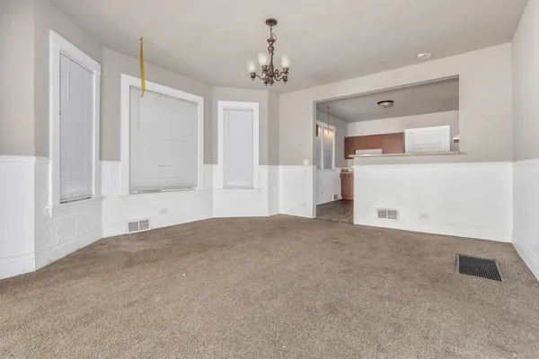 a view of empty room with a ceiling fan