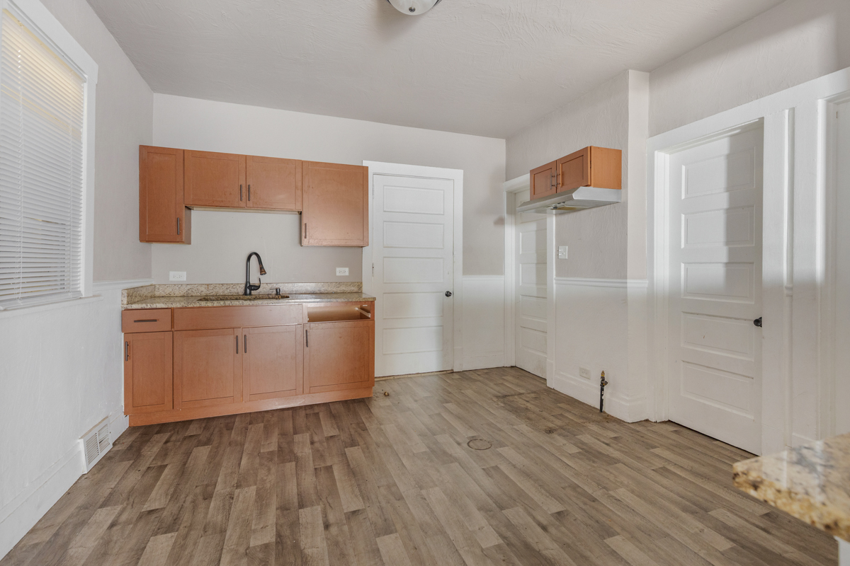 631 East 142nd Street Dolton, IL 60419 - Photo 24 of 29 a view of a kitchen with wooden floor