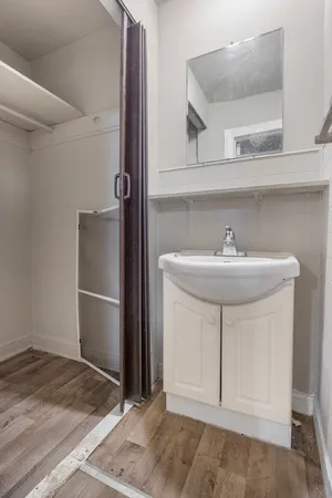 a bathroom with a sink and a mirror