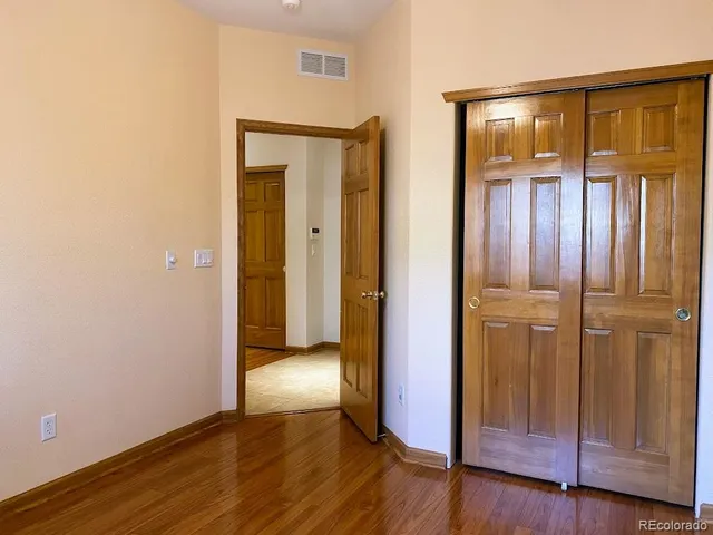 a view of a porch with wooden floor