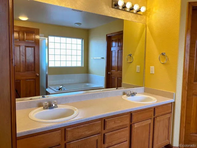 a bath tub sitting next to a window