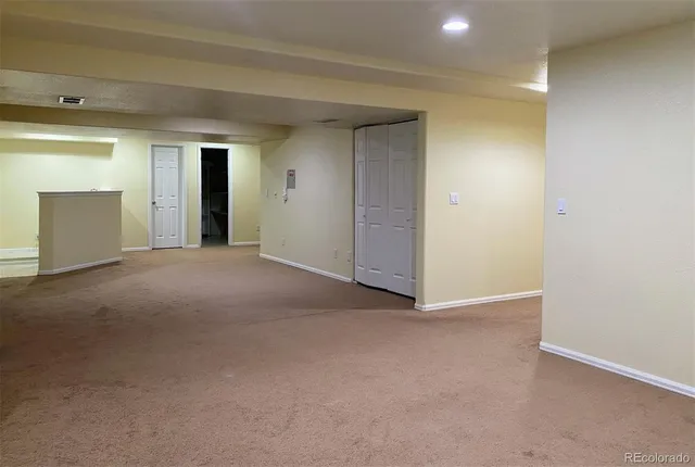 an empty room with closet area