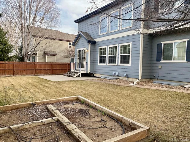 a view of a backyard of the house