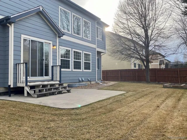 a view of a backyard of a house