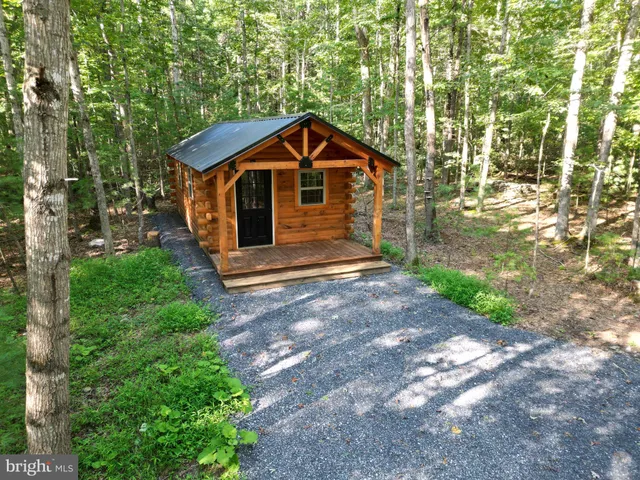 a front view of a house with yard