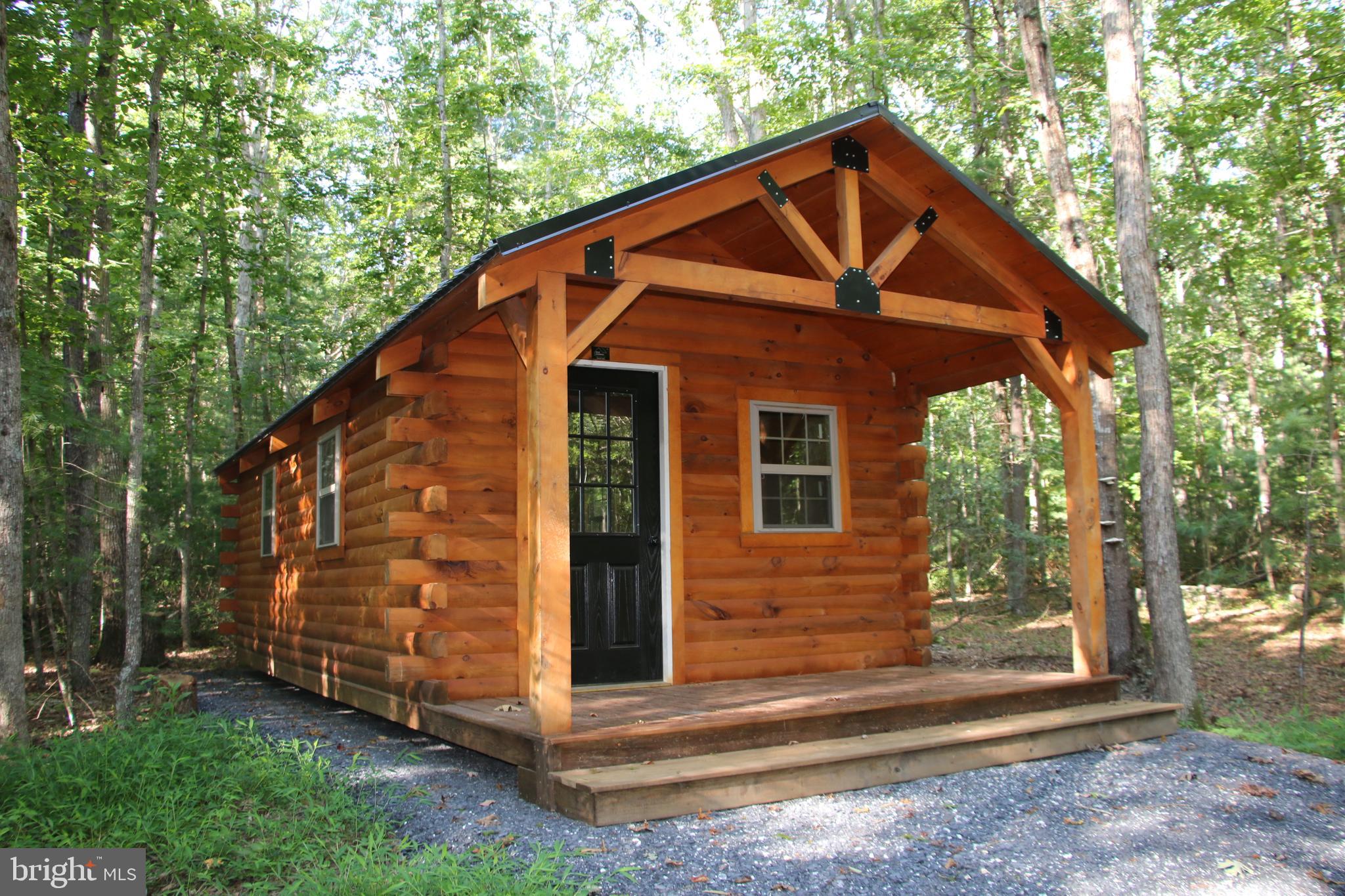 Alum Springs Road Basye, VA 22810 - Photo 12 of 63 a front view of a house with a yard
