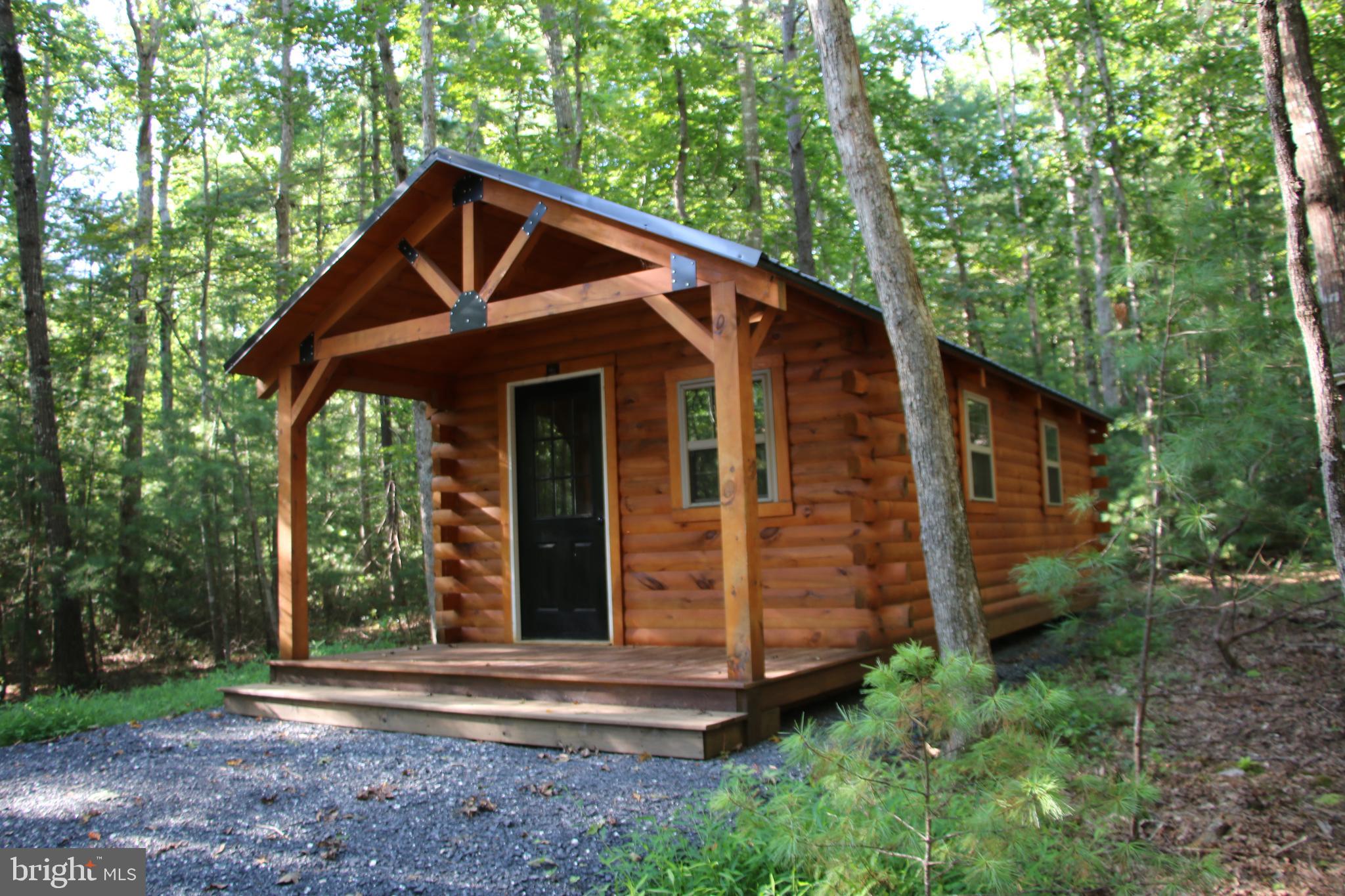 Alum Springs Road Basye, VA 22810 - Photo 13 of 63 a front view of a house with garden