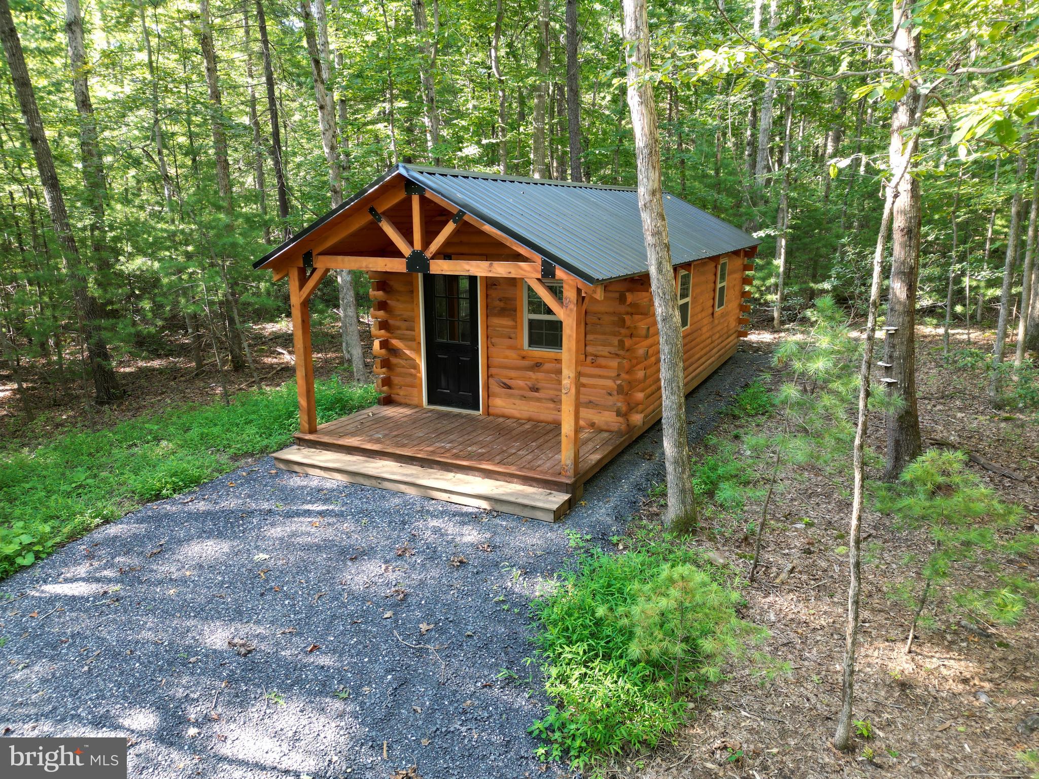 Alum Springs Road Basye, VA 22810 - Photo 2 of 63 a view of a house with large trees and yard