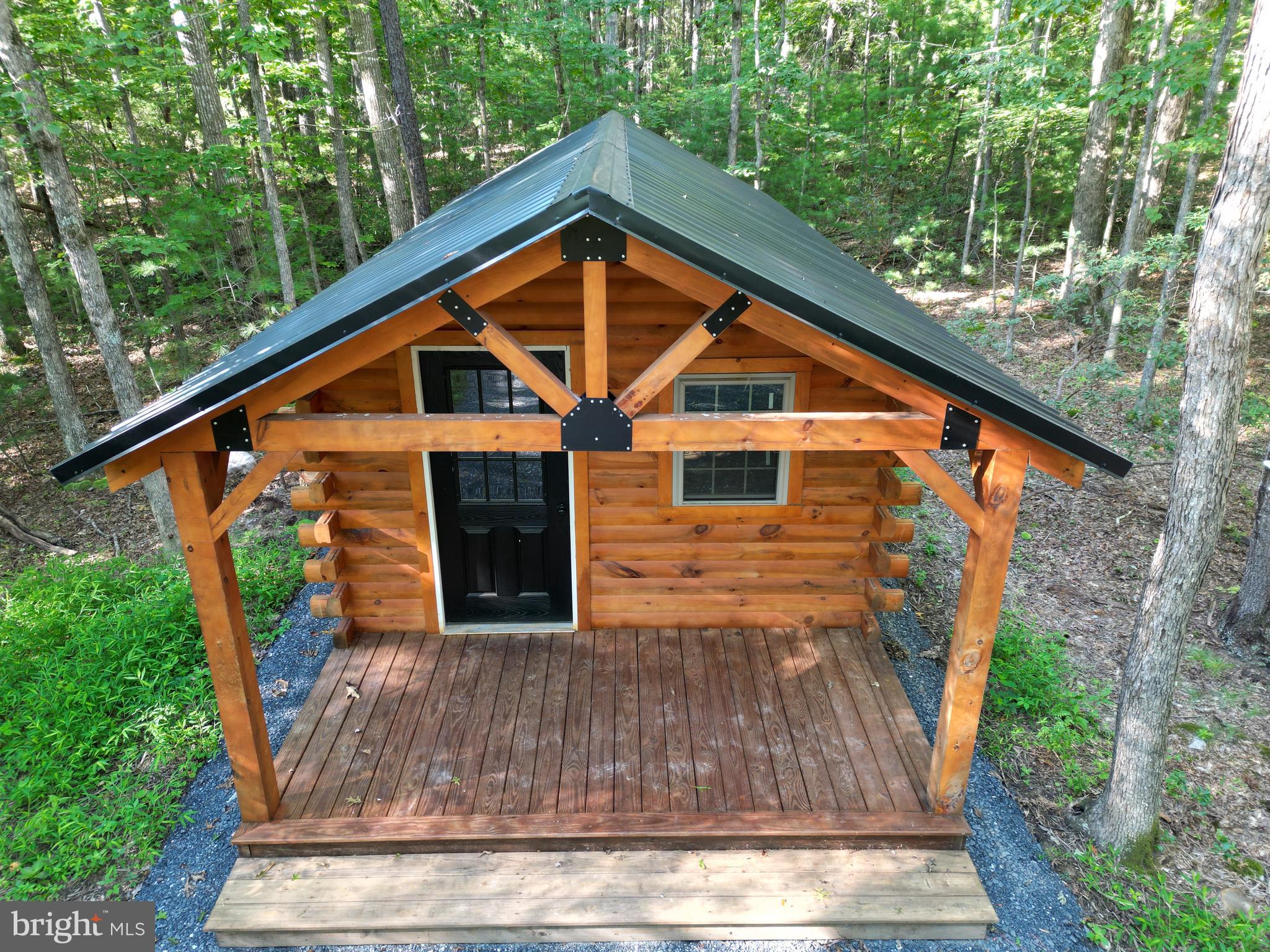 Alum Springs Road Basye, VA 22810 - Photo 3 of 63 a backyard of a house with seating space