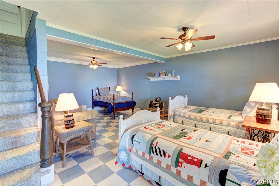 528 Old Mill Point Road Laneview, VA 22504 - Photo 20 of 30 a bedroom with bed and a chandelier