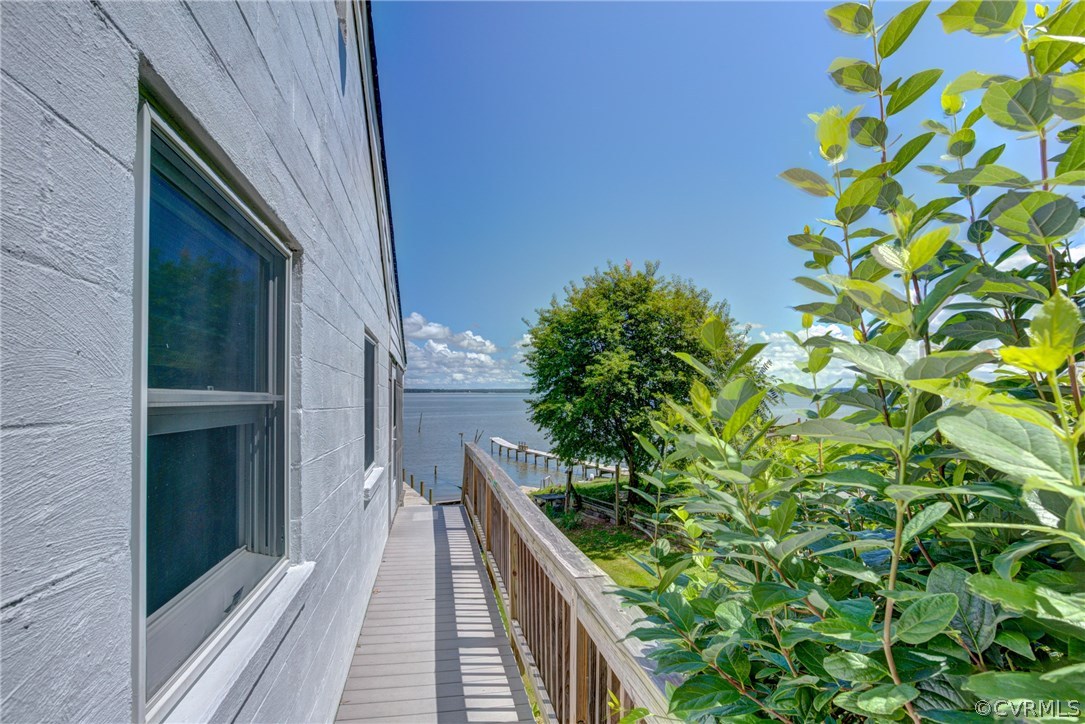 528 Old Mill Point Road Laneview, VA 22504 - Photo 3 of 30 a view of balcony with wooden floor and fence